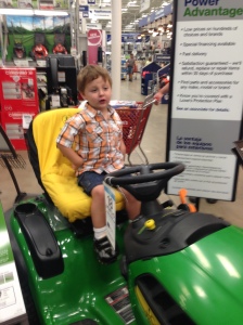 Mr. Sweetie Pants riding the "tractor".